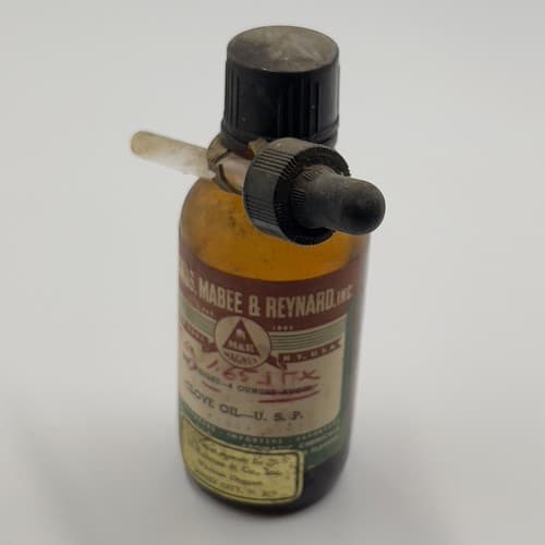 Vintage Magnus, Mabee & Reynard Clove Oil Bottle some contents