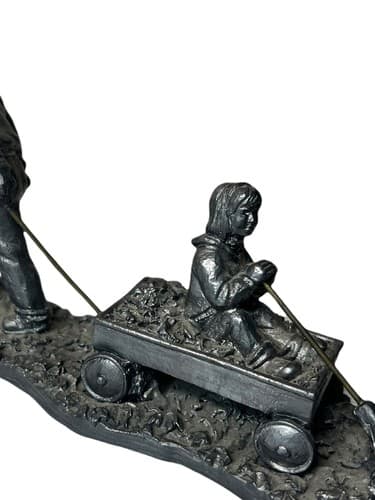 Michael Ricker pewter figurine-- Boy pulling cart with girl inside 1996 7"x4"