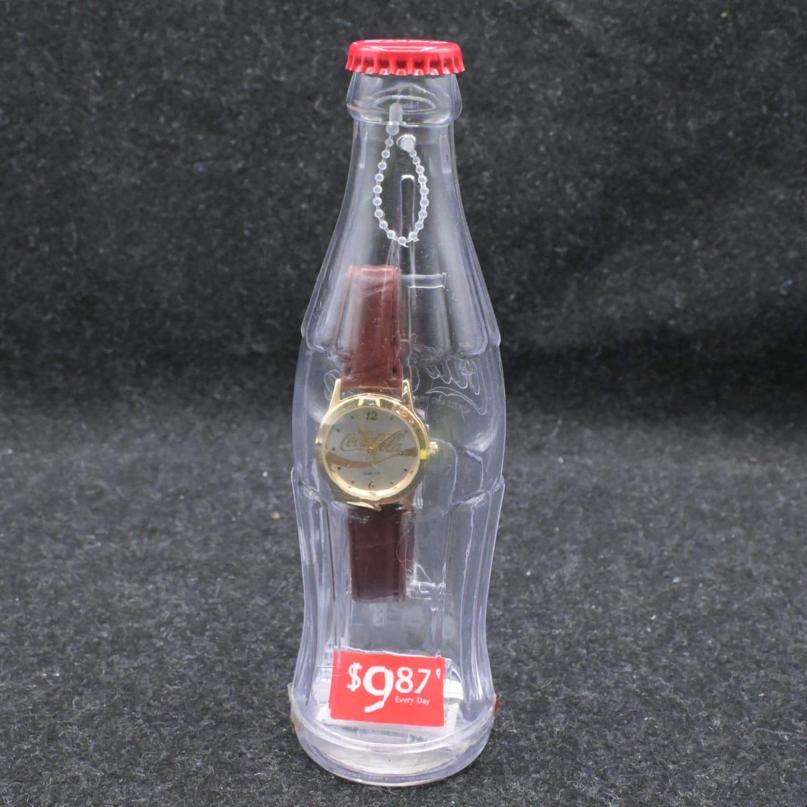 NOS 2002 Enjoy Coca-Cola Watch in Plastic Contour Coca-Cola Bottle Bank #55267W