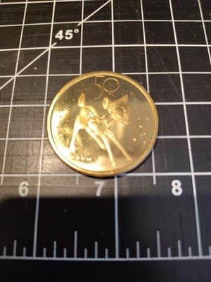 Disney 50th Anniversary Bambi Coin Medallion In Hand