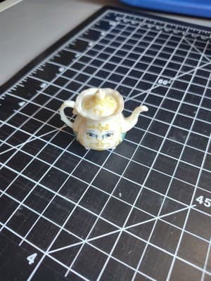 MINIATURE 1.5” X 2” PVC TEA POT WITH FACE ON FRONT FIGURE UNBRANDED (MF175)
