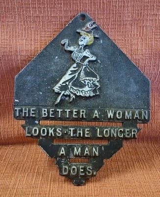 Vtg Metal Trivet "The Better A Woman Looks The Longer A Man Does" Wall Hanger US
