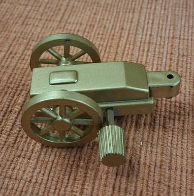 Vtg Very Rare Brass Color Wind-Up Plastic Toy Made In 1980s Cannon Wheel Trailer