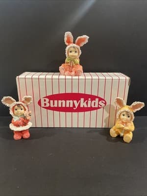 Lot Of 3 Bunny Suit Costume Girl 3" Figurines Holding Flowers Pink Yellow Ears