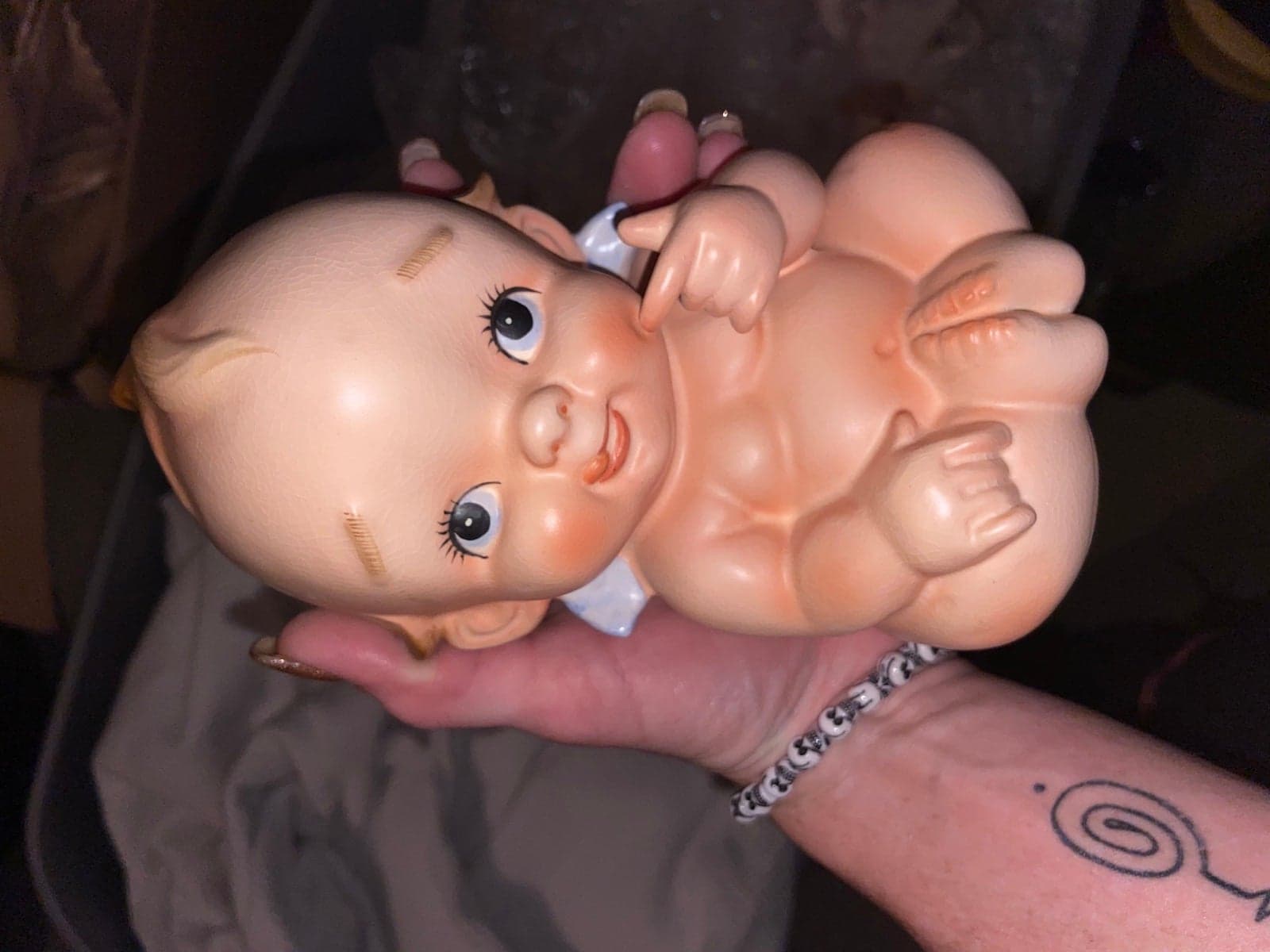 Antique, porcelain kewpie doll bank