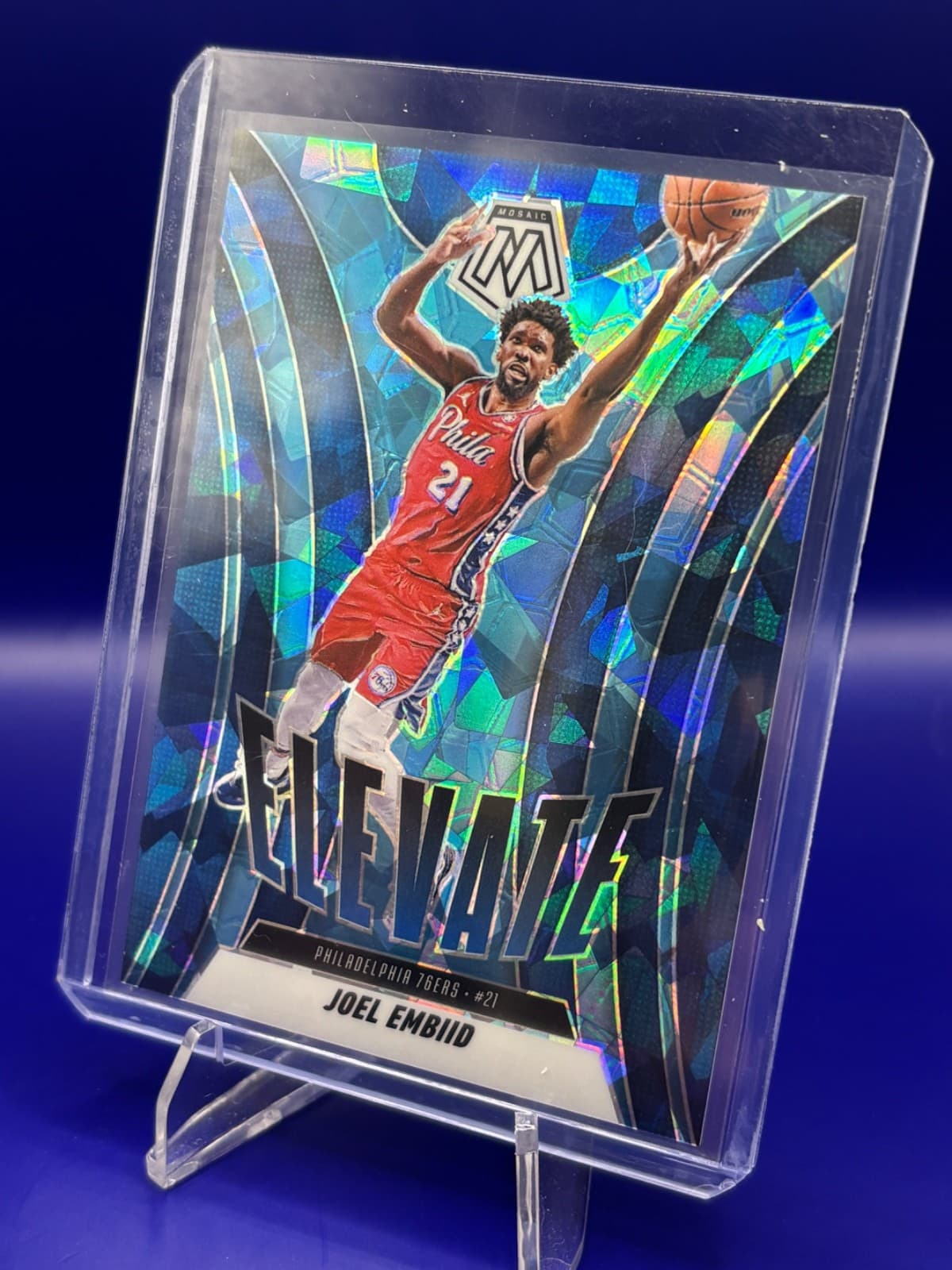 2024-25 Panini Mosaic Joel Embiid Elevate Blue Cracked Ice Prizm /125 #23 76ers