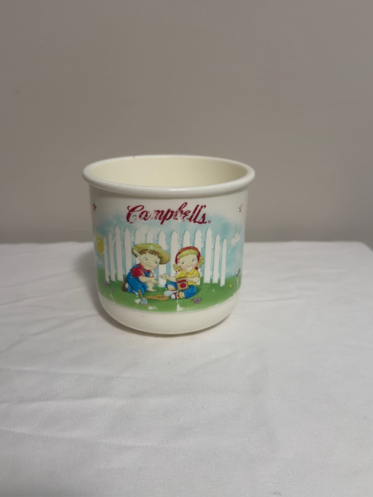 Vintage Campbell's Soup ceramic mug with kids playing illustration