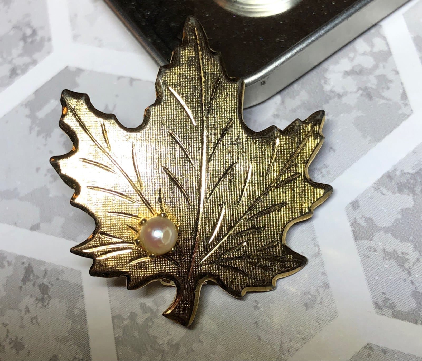 Gold-tone maple leaf with pearl Brooch