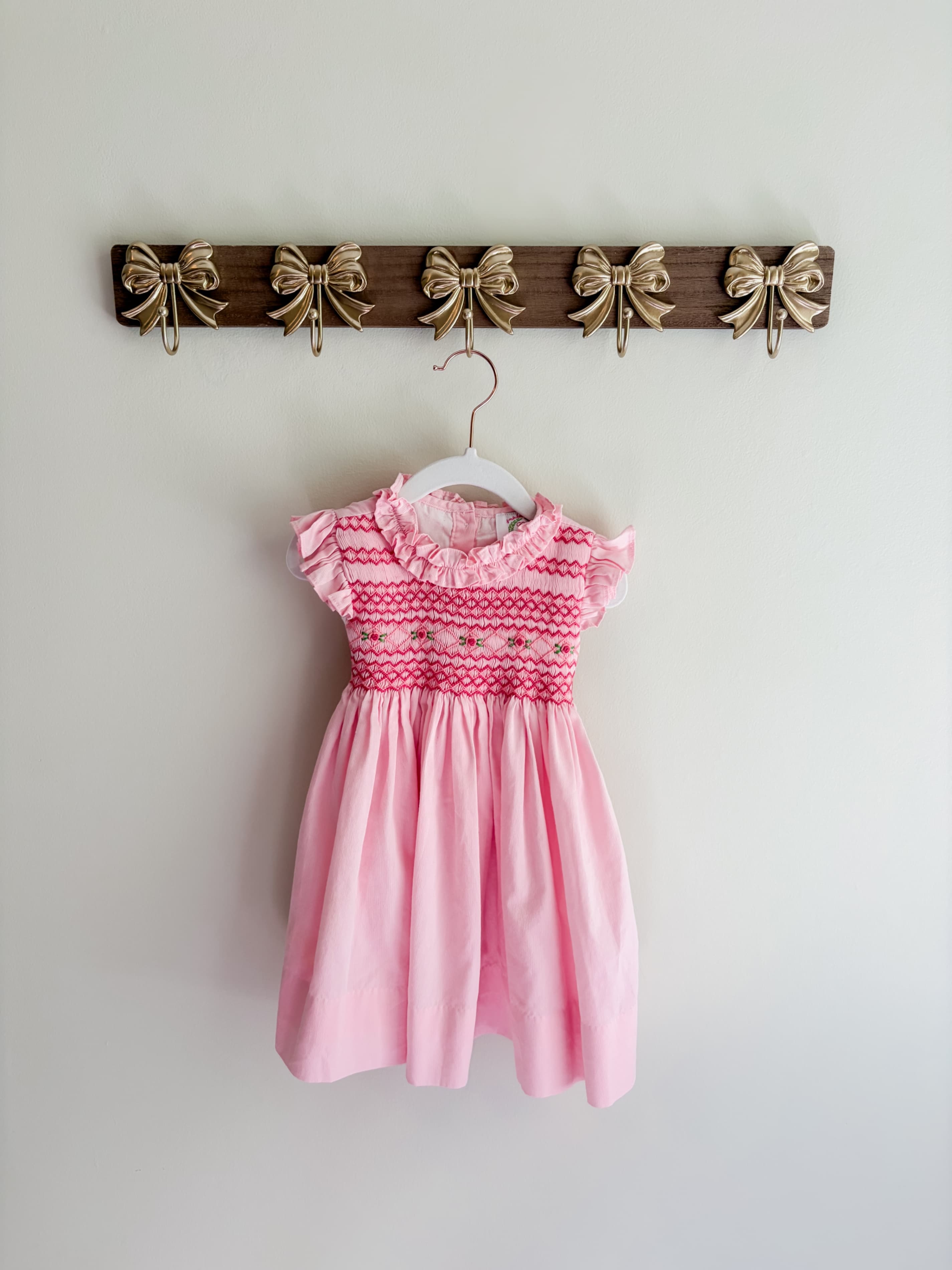 Cecil & Lou size 24 months Pink Smocked Dress with Ruffle Sleeves and Bow Back with slight stains pictured