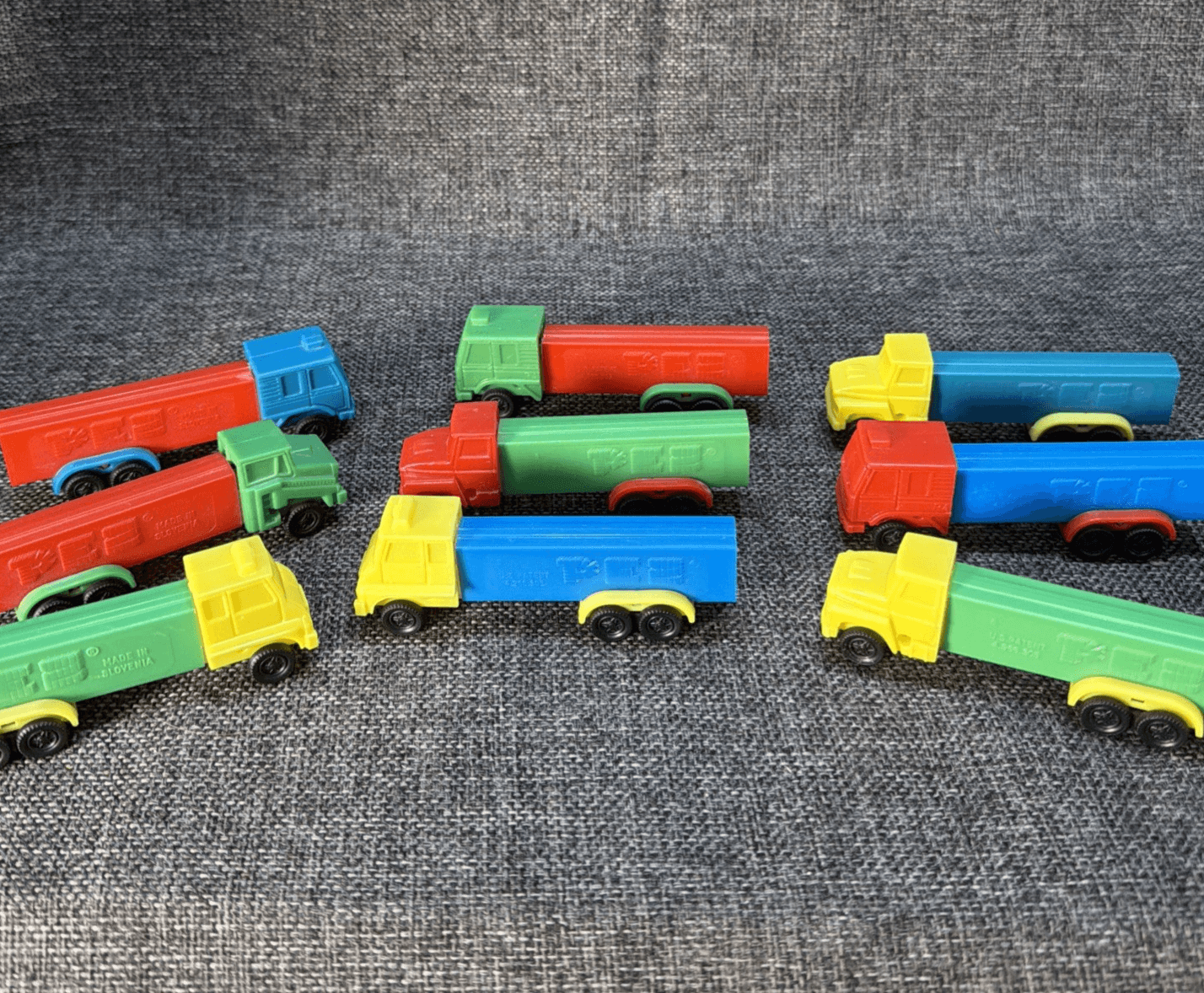 Lot Of 9 D Series Pez Truck Rigs With Fixed Wheels R1 - R4 Red Green Blue Yellow