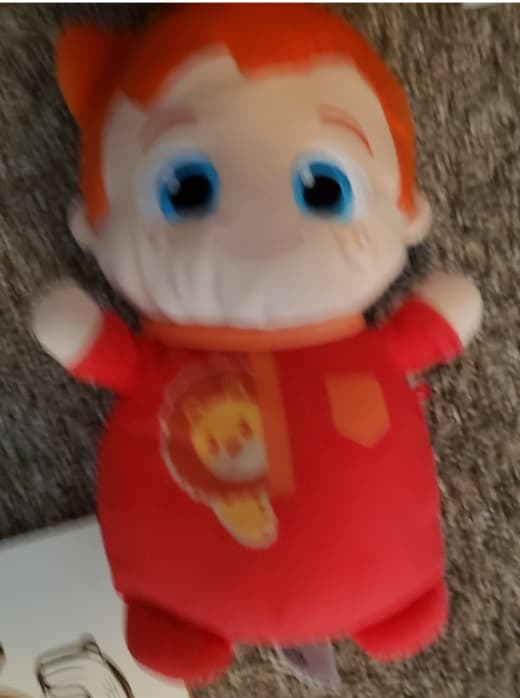 Plush Doll with Red Outfit and Blue Eyes