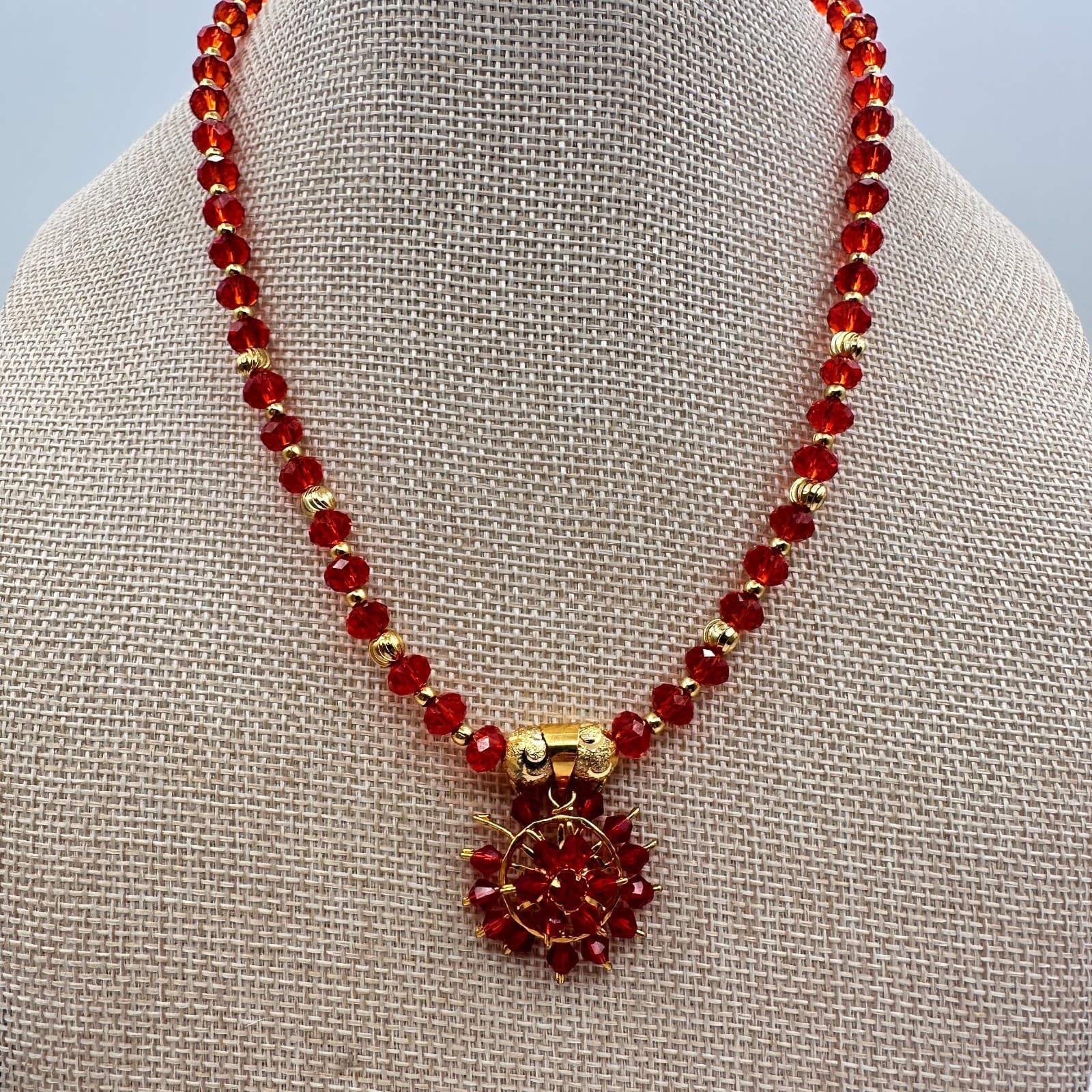 Vintage 80s Red Faceted Bead Necklace Gold Tone Floral Starburst Pendant Jewelry