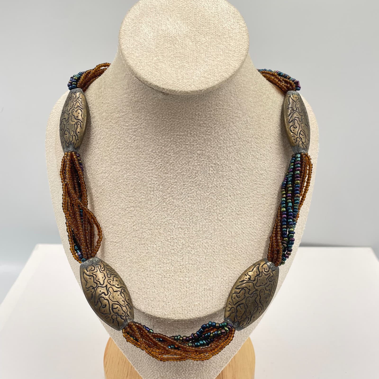 Vintage Boho Multi Strand Seed Bead Necklace Etched Bronze Tone Oval Focal Beads