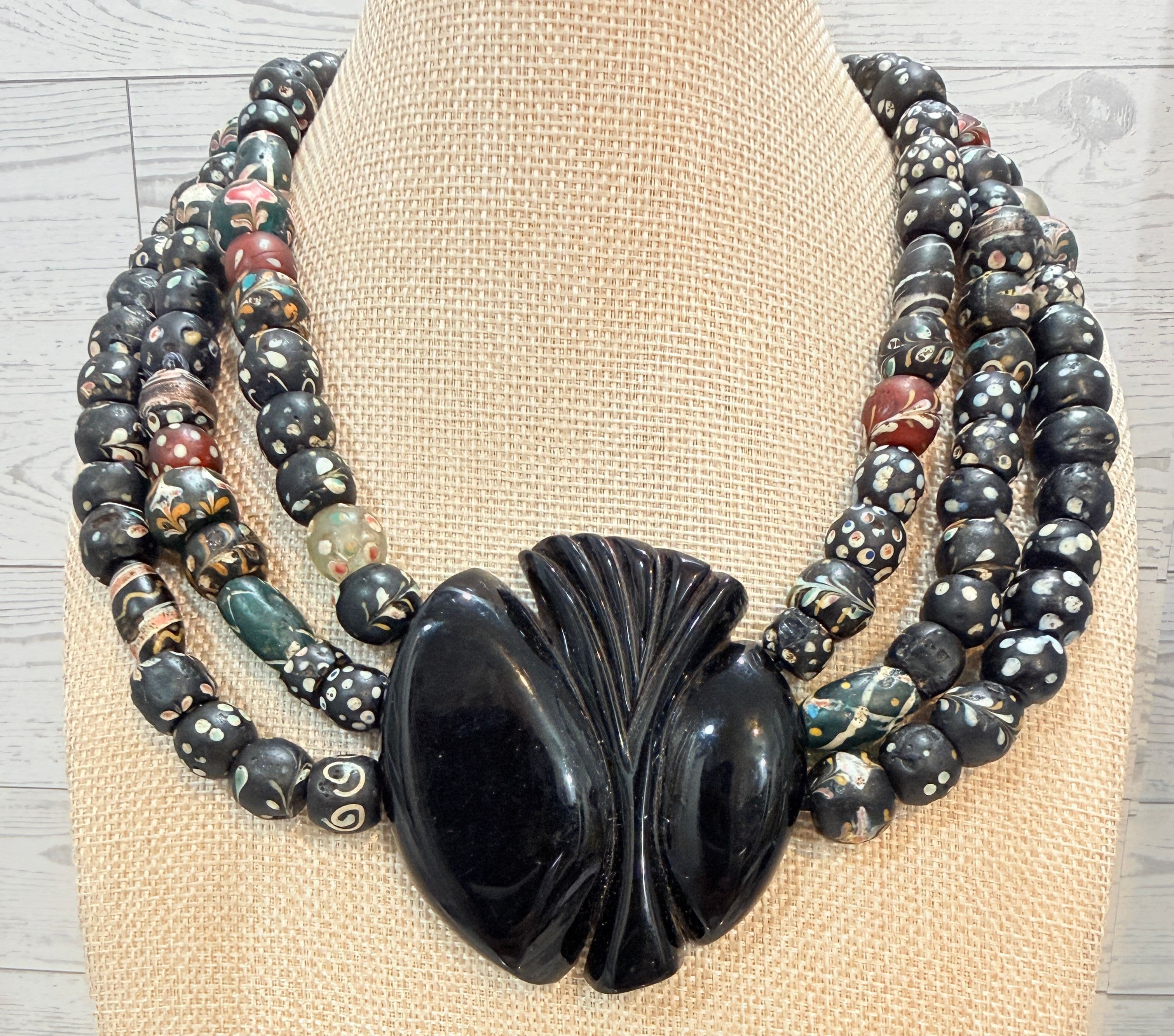 6P. 19th Century Triple Strand African Trade Bead Necklace with Carved Hoof Pendant