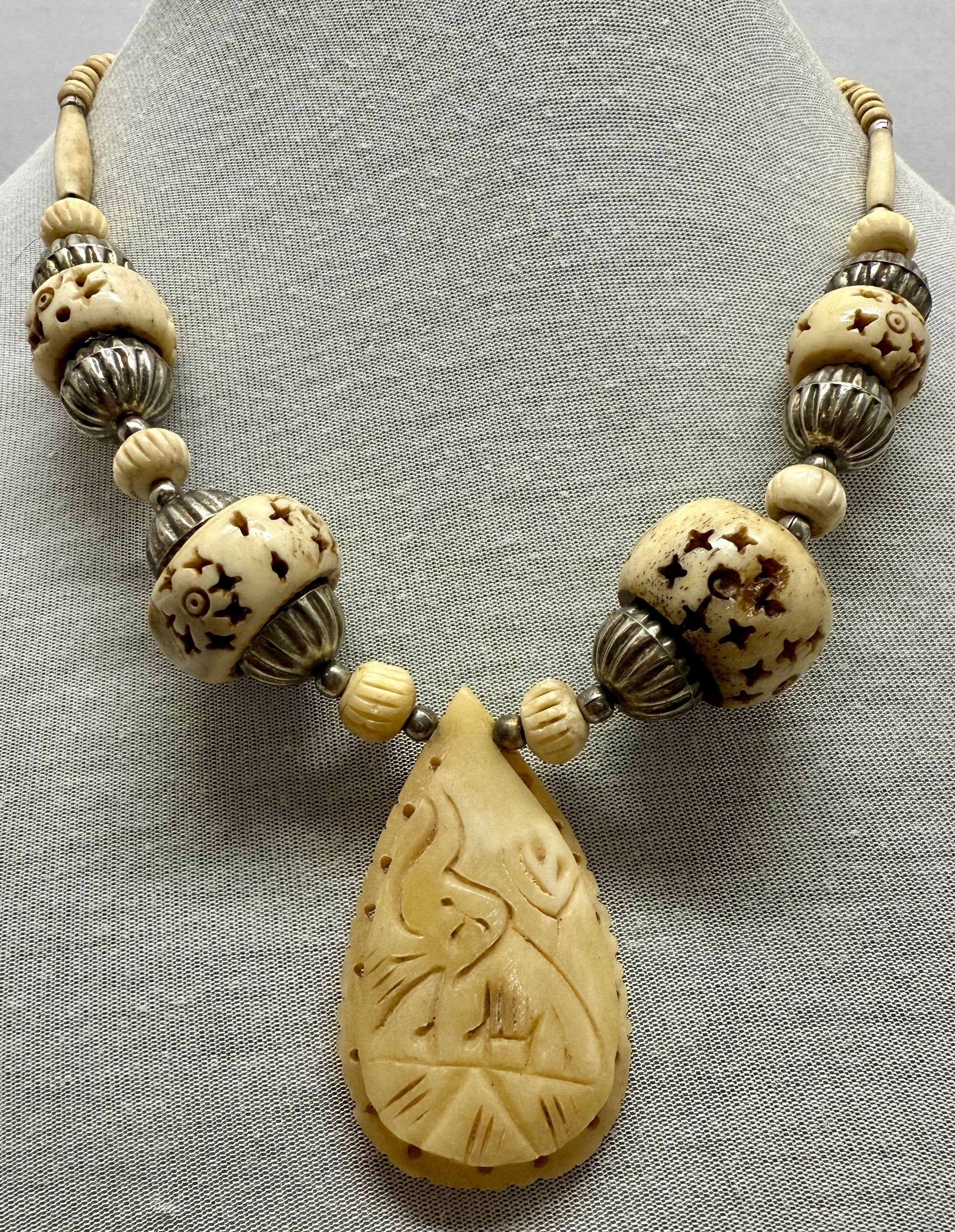 5E. Vintage 1960s Hand Carved Bone Bead & Pendant with Silver Tone Metal Accents