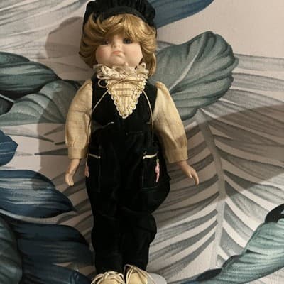 VINTAGE COLLECTIBLE 14”PORCELAIN DOLL IN GREEN VELVET PANTS & VEST BLONDE HAIR