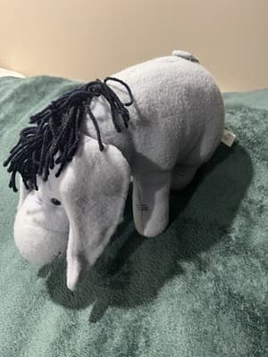 A Plush Toy of The Disney Character Eeyore Made In China. Disney Store