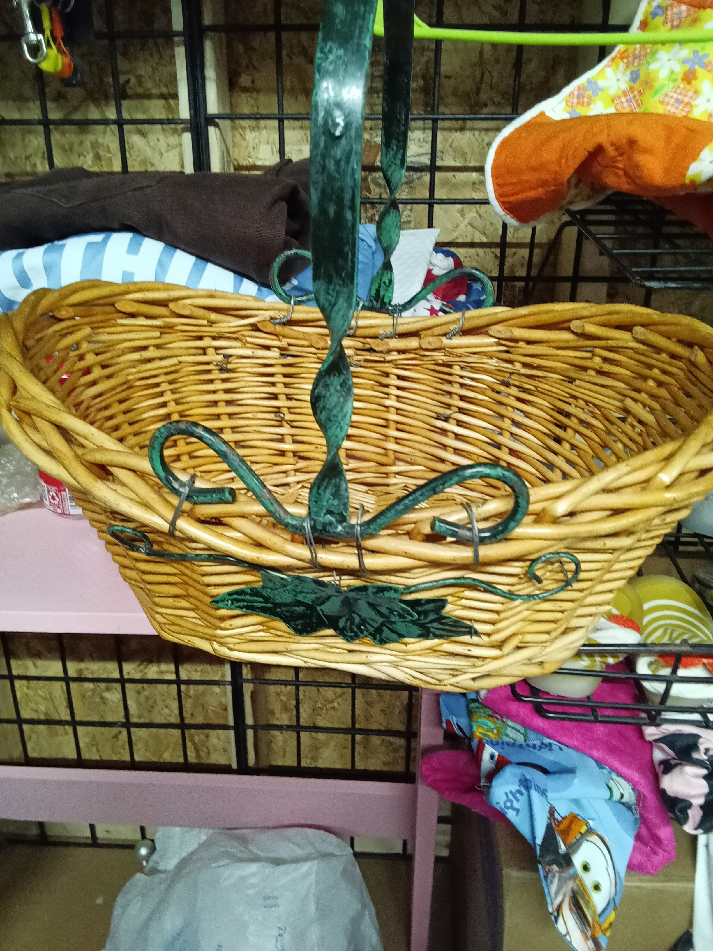 Wicker Basket with Green Metal Handle and Leaf Design