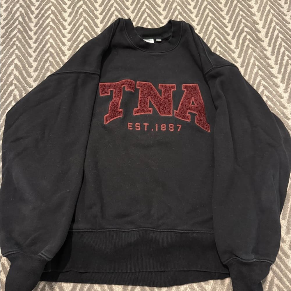 TNA Women’s Black Crewneck Sweater with Burgundy Logo
