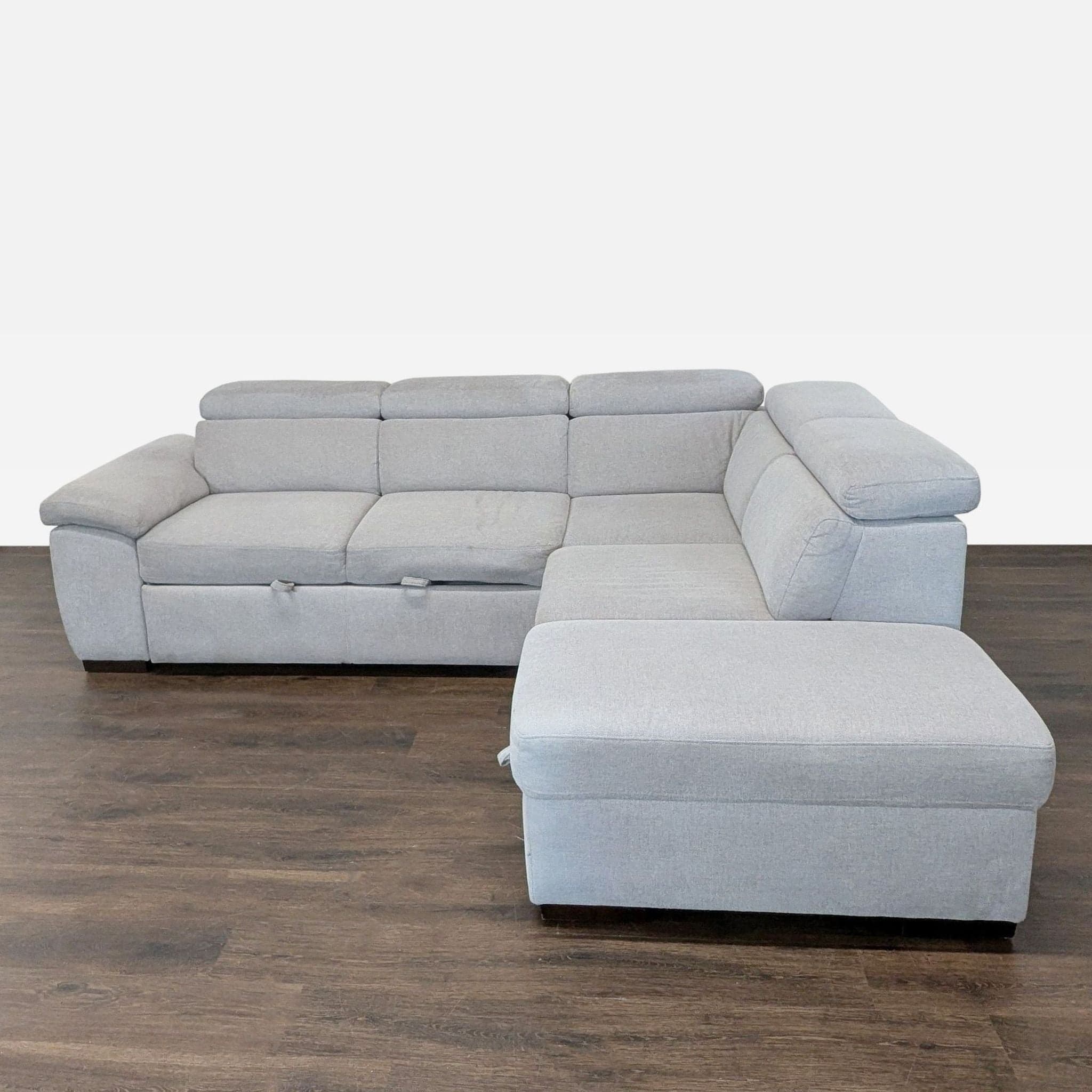 Living Spaces Modern Light Gray Sectional Sofa with Storage and Pull-Out Bed
