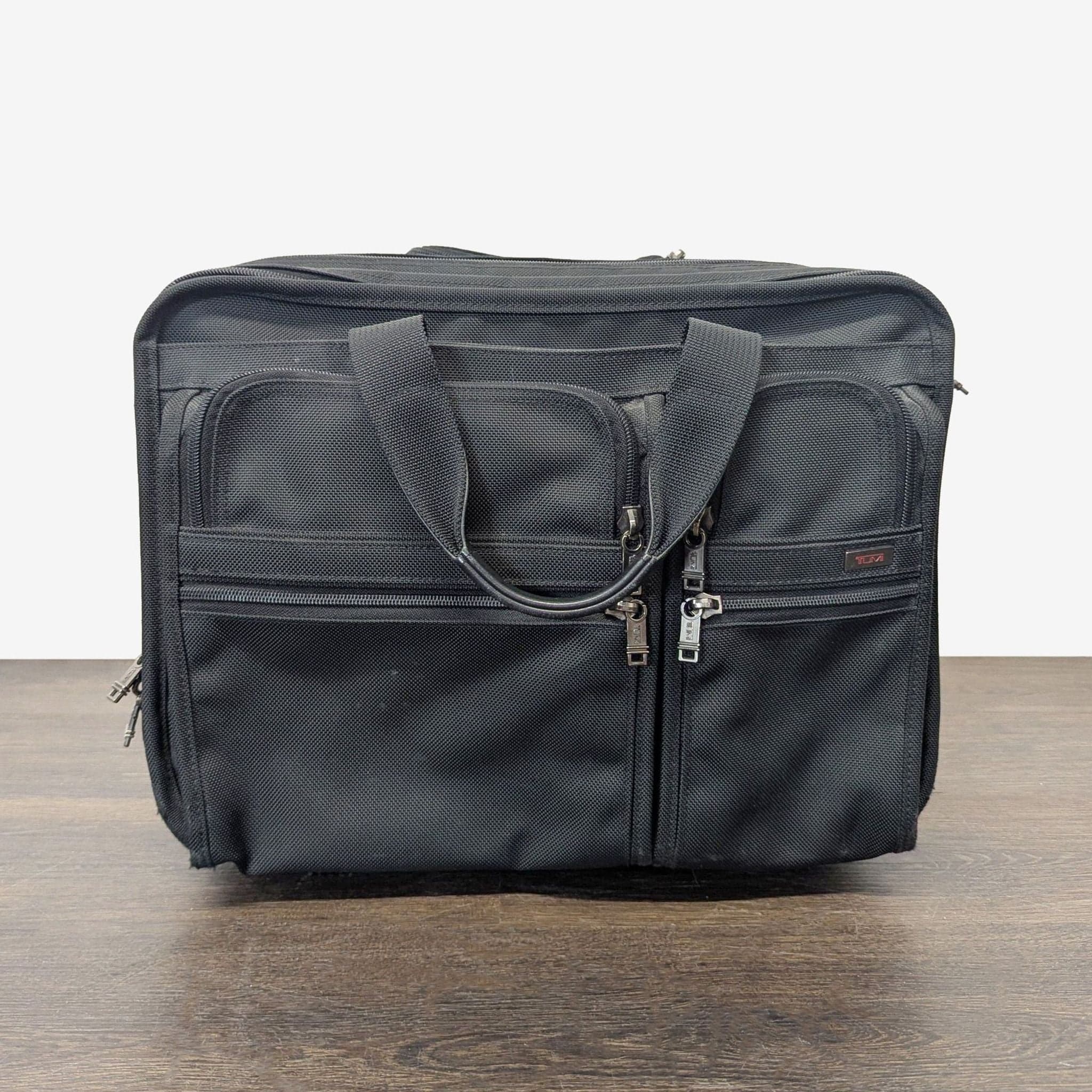 Tumi Black Rolling Carry-On Travel Bag with Telescopic Handle