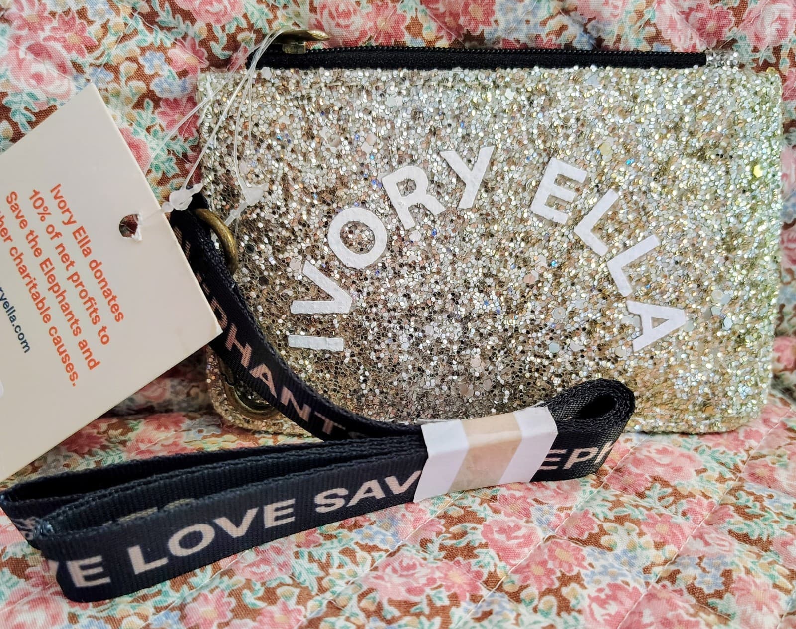NWT Ivory Ella gold glitter pouch with a black elephant strap