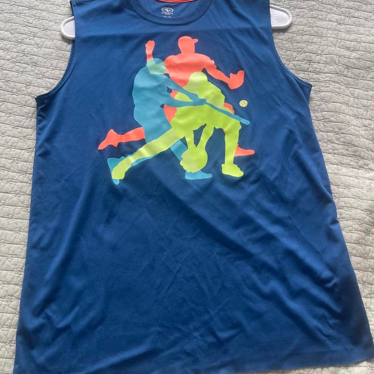 Stay cool during practice, workouts, or game day in this Athletic Works Boys Sleeveless Performance Tank Top. This royal blue athletic tank features a colorful sports graphic with baseball, softball, and other athletic silhouettes across the front, making it a fun choice for active kids.