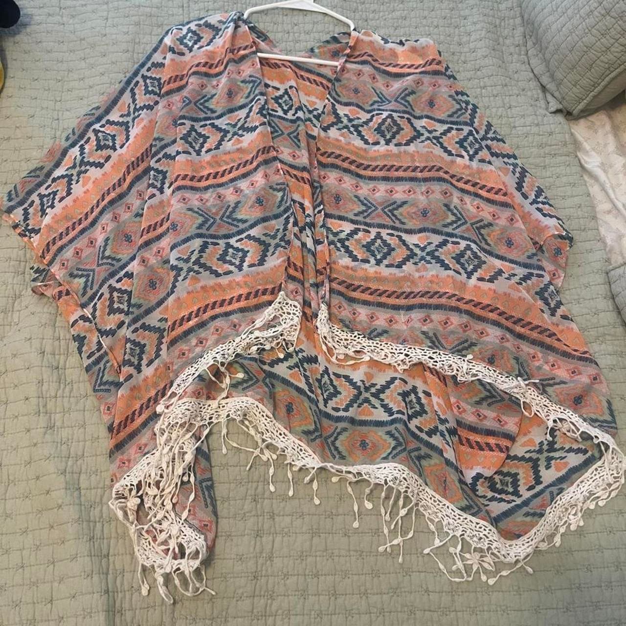 Orange, blue, and white geometric patterned poncho with crochet trim #boho #festival #poncho #cardigan