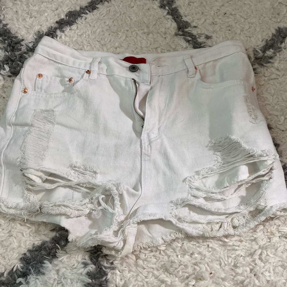 White ripped shorts