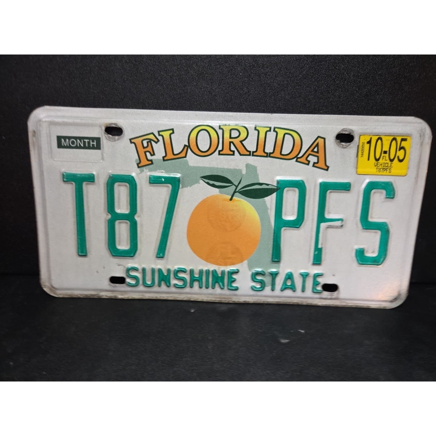Florida Sunshine State License Plate T87 PFS, Orange Graphic 2005 Expired