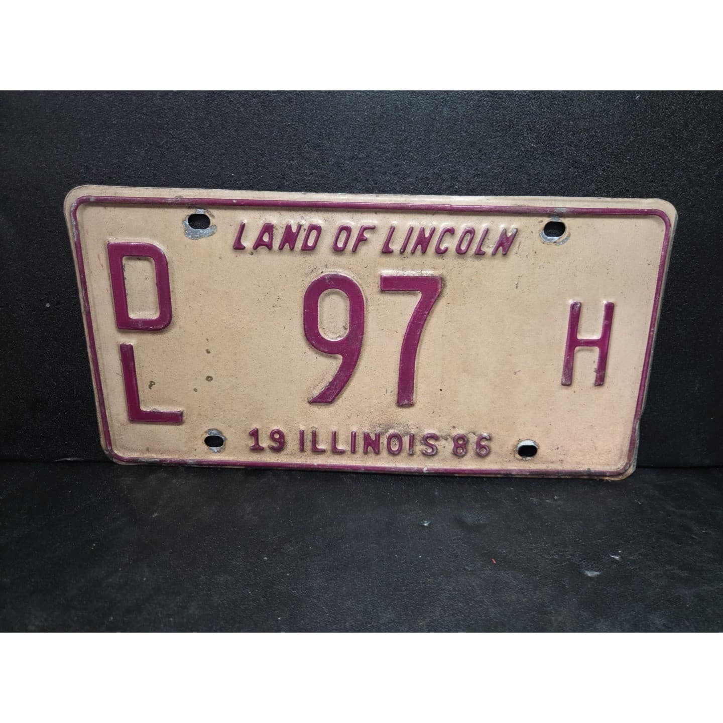 Illinois License Plate DL 97 H, Land of Lincoln, Maroon Cream Metal Vintate 1986