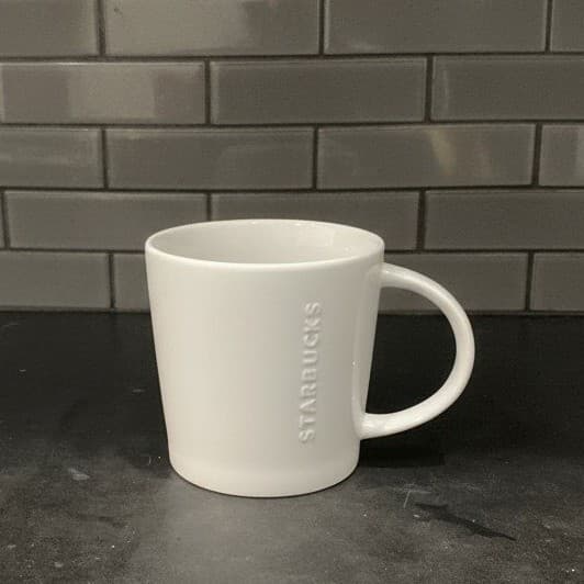 Starbucks White Embossed Letters Coffee Cup, Neutral Raised Design Drinkware