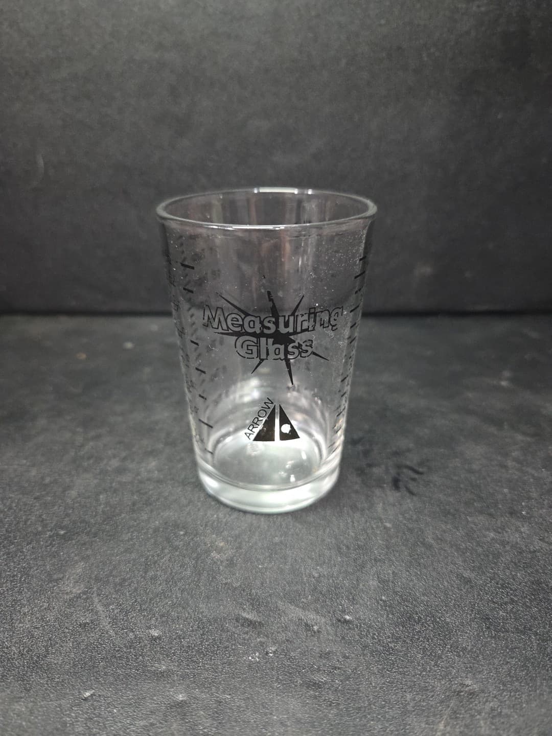 Arrow Measuring Glass. Black. Oz, Tbs, Tsp, and Ml.